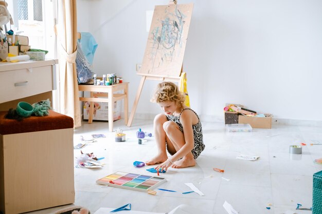 creative mess in kids room talented child girl playing with play dough