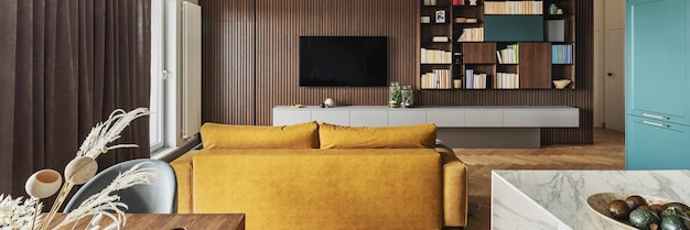 Creative and modern vintage living room interior design with yellow sofa and lamella wall with tv