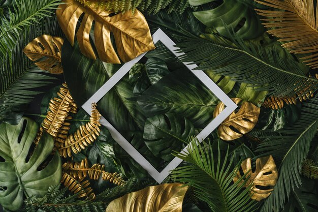 Creative nature background Gold and green tropical palm leaves Minimal summer abstract junlgle