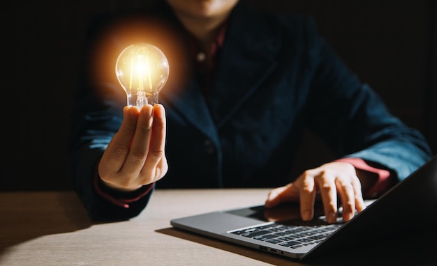 Creative new idea Innovation brainstorming inspiration and solution concepts The man is holding light bulb Copy space background