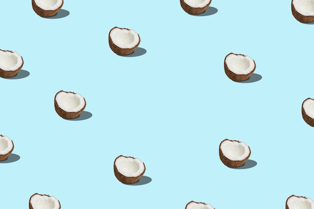 Creative pattern with coconut on blue background.