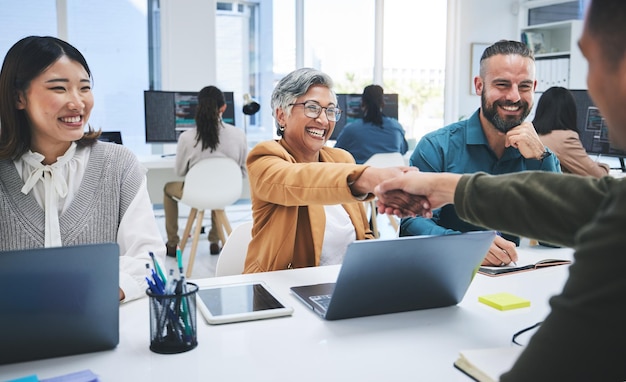 Creative people fist bump and meeting in teamwork success or achievement together at office Group of employees touching hands in startup project winning or team building promotion at workplace