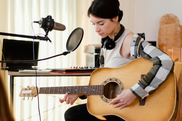 Photo creative person practicing music at home