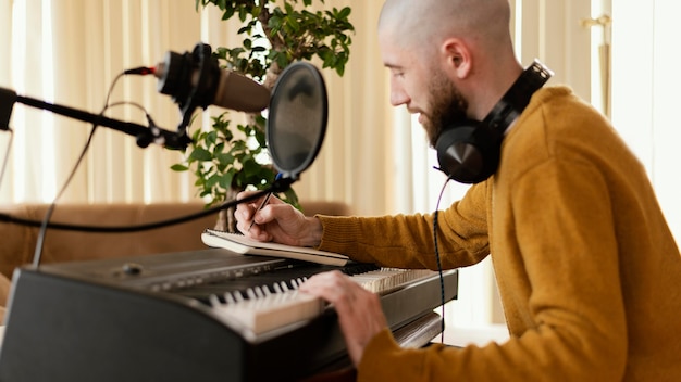 Photo creative person practicing music indoors