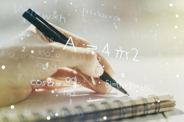 creative scientific formula concept with woman hand writing in notebook on background multiexposure
