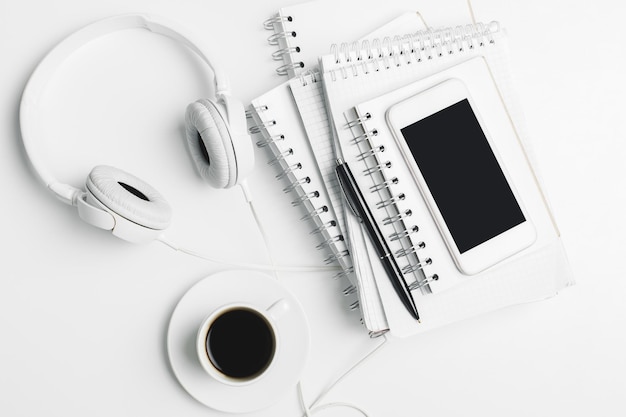 Creative table top with devices and supplies