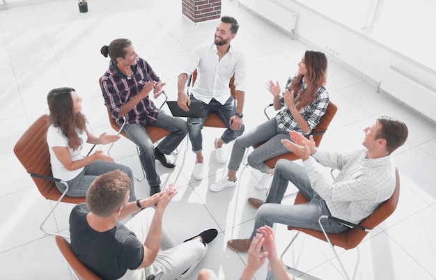 Creative team holds a meeting in the lobby