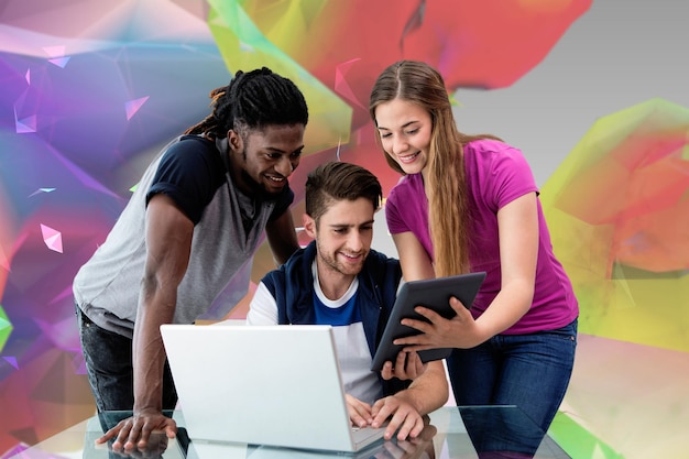 Photo creative team looking at digital tablet against colourful abstract design