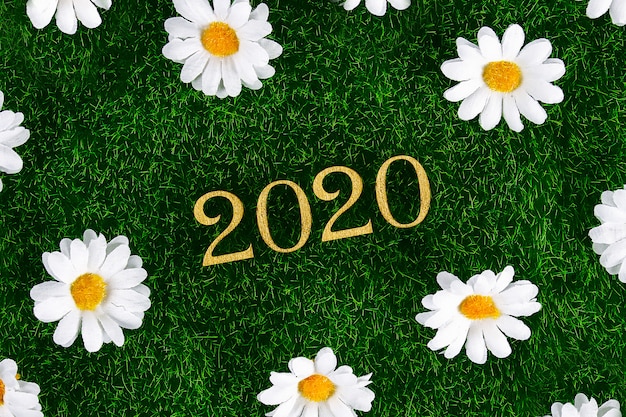 Creative text Happy New Year 2020 written in gold wooden letters.