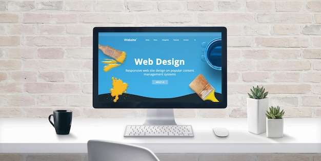 creative web design studio concept with web presentation on modern computer display cup of coffee and plants beside brick wall in background