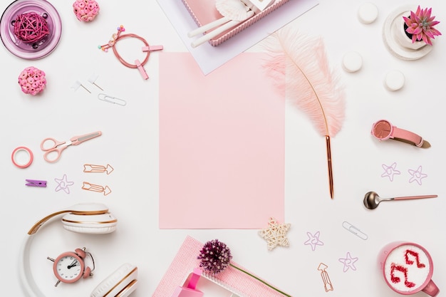 Photo creative woman desk top view with pink blank paper