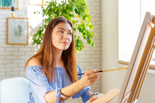 Creative woman working in art studio