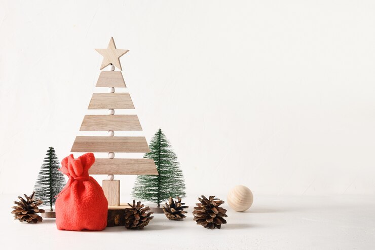 Photo creative wooden eco christmas tree and pine cones on white background diy