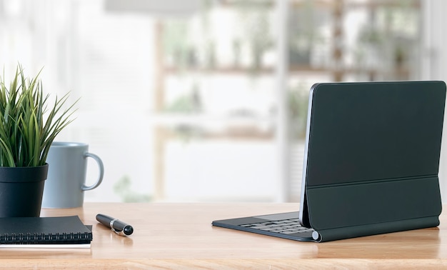 Creative workspace mockup with rear view of tablet