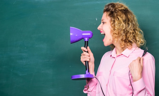 Creativity and inspiration student girl working with\
electricity brainstorming woman enlightenment idea and inspiration\
teacher with lamp at school blackboard education concept back to\
school