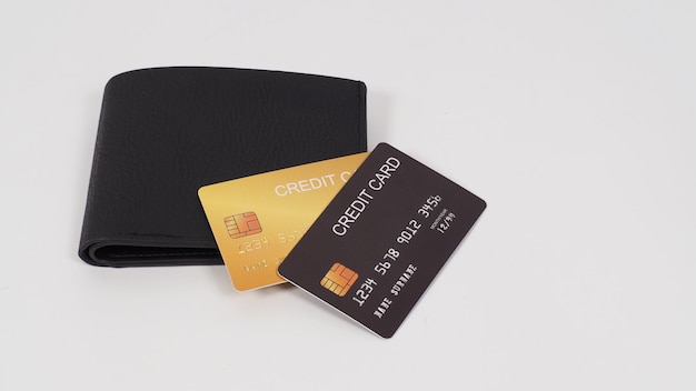 credit card black and gold color in black on wallet isolated on white background.