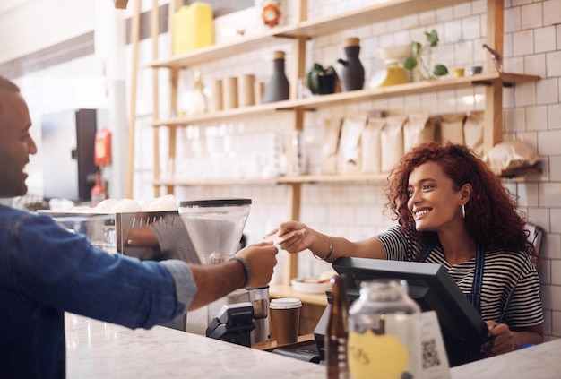 Photo credit card coffee shop and happy woman with customer for payment financial transaction and point of sales service finance trade and bills at cashier in cafe b2c shopping and restaurant store