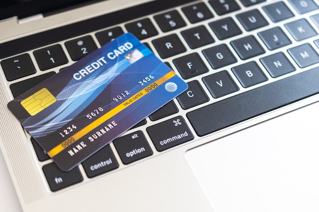 Credit card on a computer keyboard. internet purchase concept