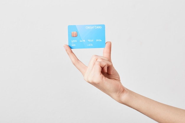 Photo credit card in hand on white