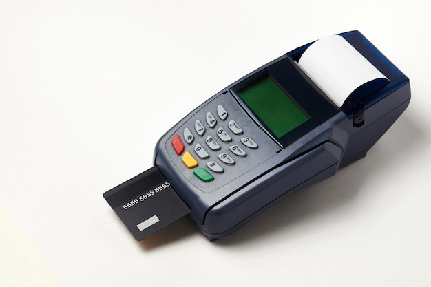 Credit card payment, buy and sell service. Payment terminal and credit card on white background