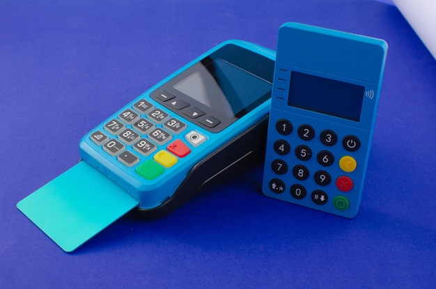 Credit card payment machinePOS terminal and bank cardConcept of payments money purchases and credit.