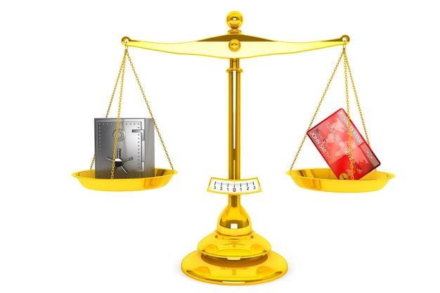 Credit card and safe on scales puted on a white background