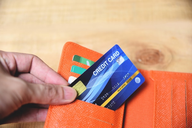 Credit card in wallet with hand 