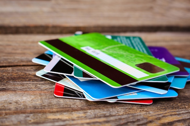 Credit card on wooden background. 