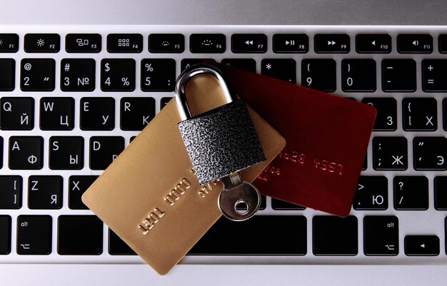 Credit cards and lock on keyboard close up