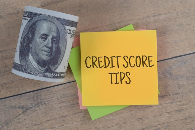 Photo credit score tips wording with money. business financial education economy concept