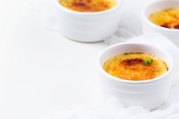 Creme brulee on a white table