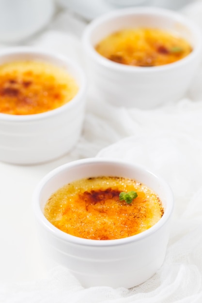 Creme brulee on a white table