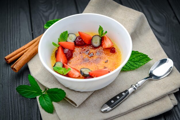 Creme brulee with fruits and berries