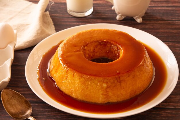 Creme Caramel Condensed Milk Pudim with melting caramel topping in front view