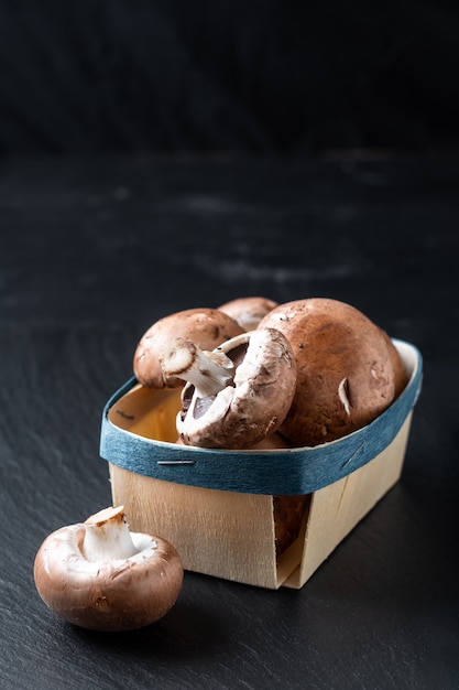 Cremini brown mushrooms in basket