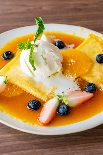 crepe suzette with vanilla ice-cream and fresh fruit