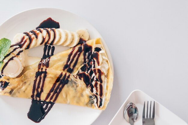 Crepe with banana and chocolate and vanilla 