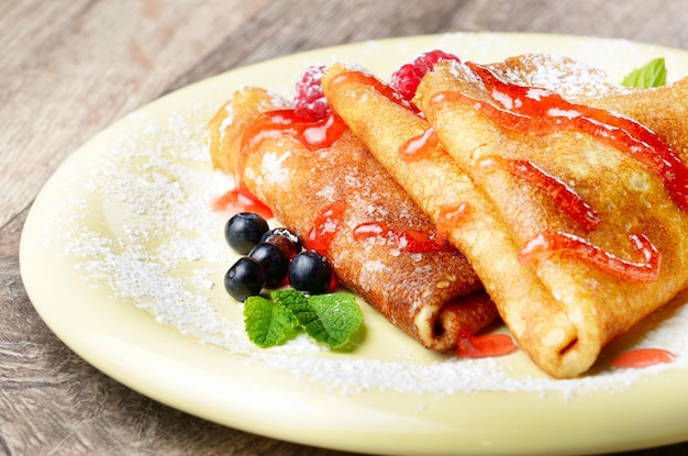 Photo crepe with raspberries and blueberries