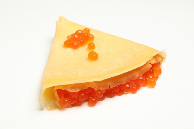 Crepe with red caviar isolated on white background