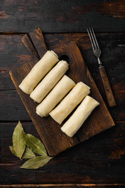 Crepes frozen on old dark wooden table background top view flat lay