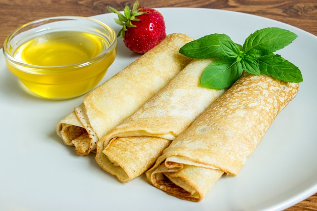 Crepes with strawberry and honey