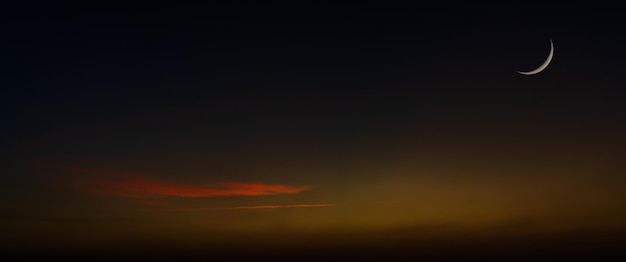 Crescent moon on dusk sky twilight after sundown