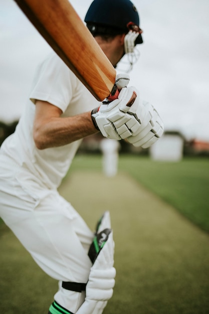 Cricketer on the field in action