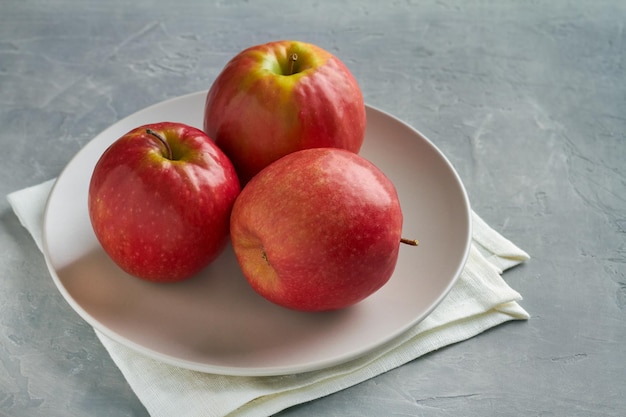 Cripps pink apples on grey background