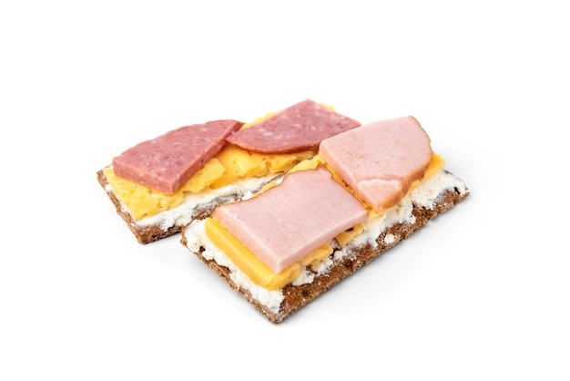 Crisp bread with cheese and sausage isolated on white background.