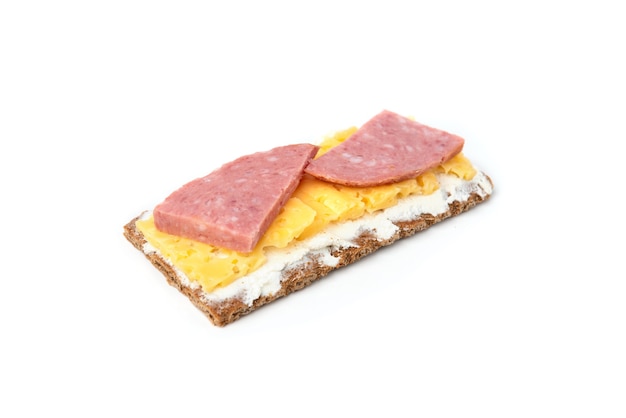 Crisp bread with cheese and sausage isolated on white background.