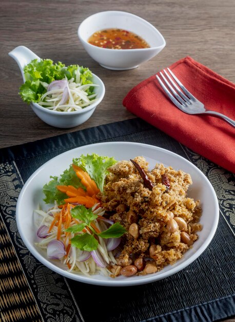 Crisp Catfish Flake Salad on the wooden table