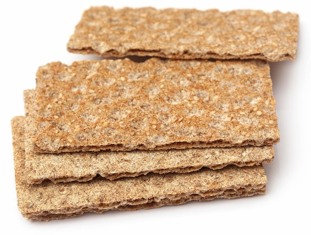 Crispbread with sesame seeds over white background