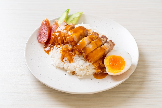 crispy belly pork on rice with barbecue red sauce