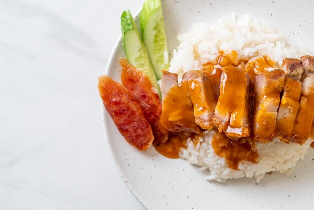 crispy belly pork on rice with barbecue red sauce